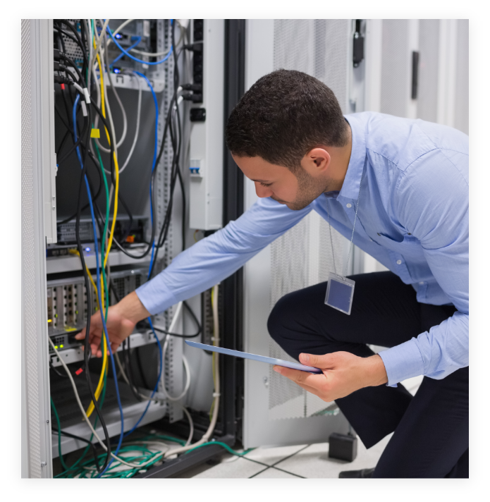 Man working on system with wires