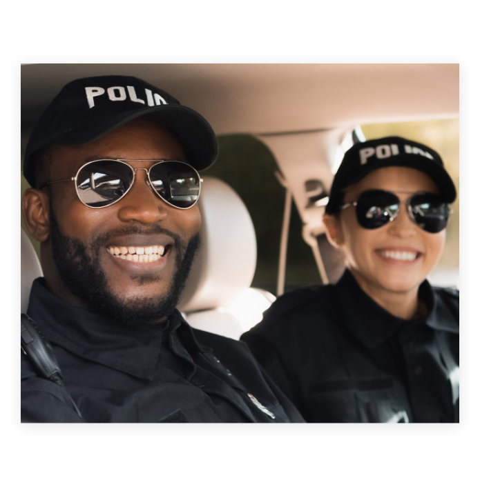 Two smiling police officers