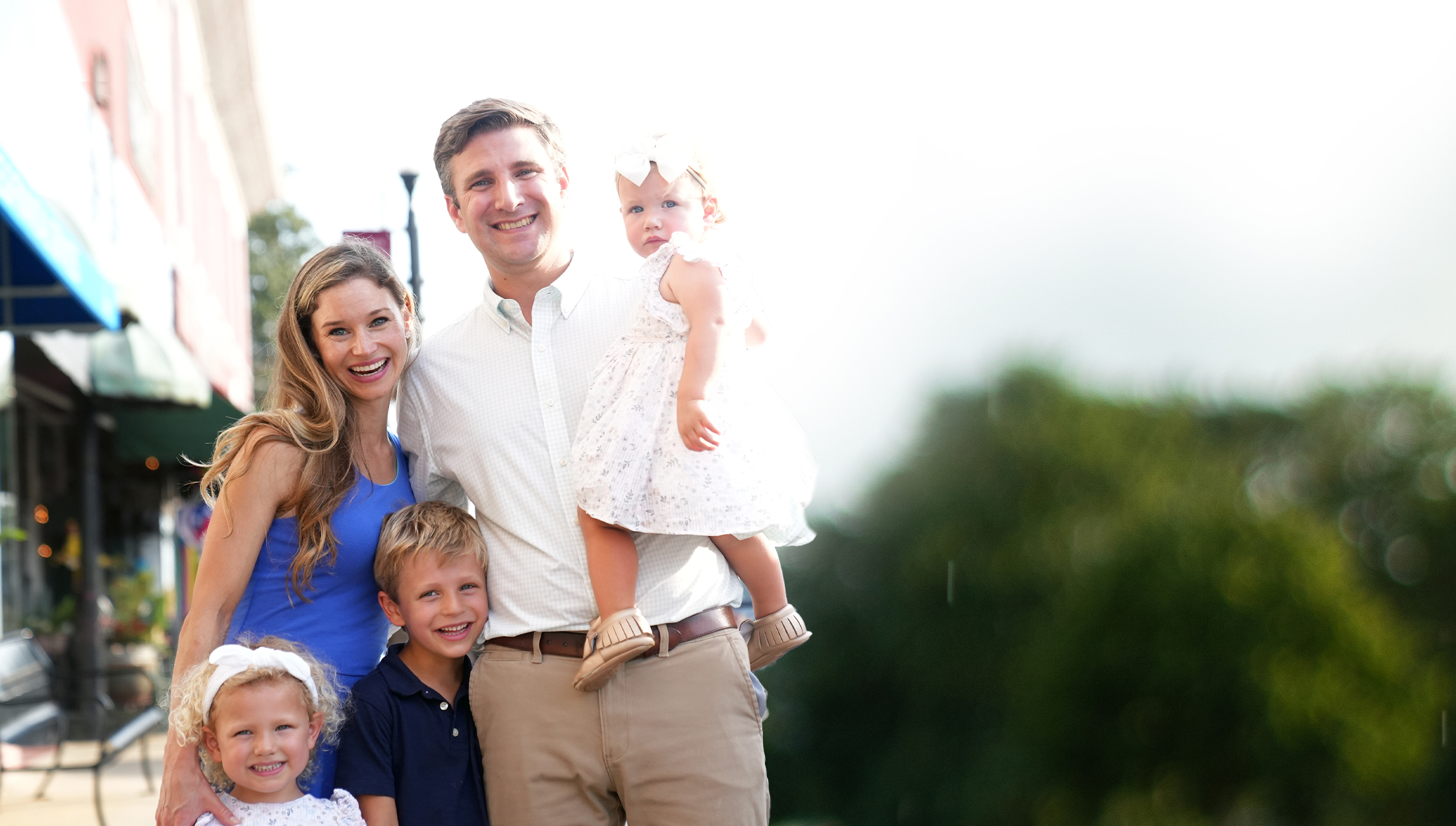 John Harris, wife, son, and two daughters smiling