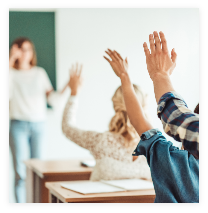 raised hands in a classroom